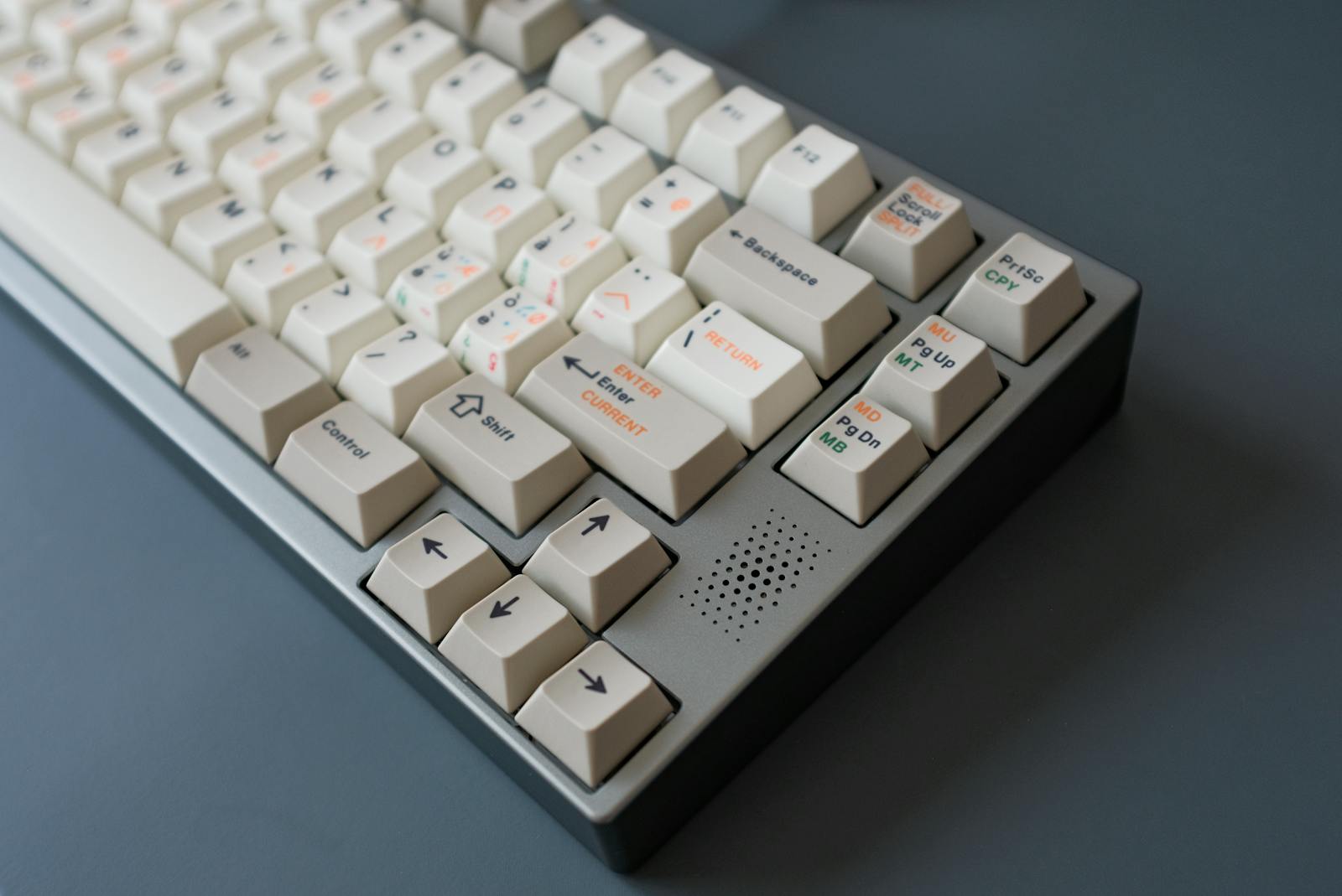 Detail of polished keycaps catching warm light.